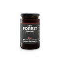 Jar of forest honey with a black label on a white background