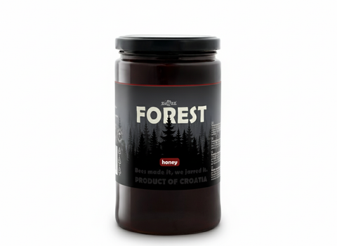 Jar of honey labeled 'Forest' on a white background